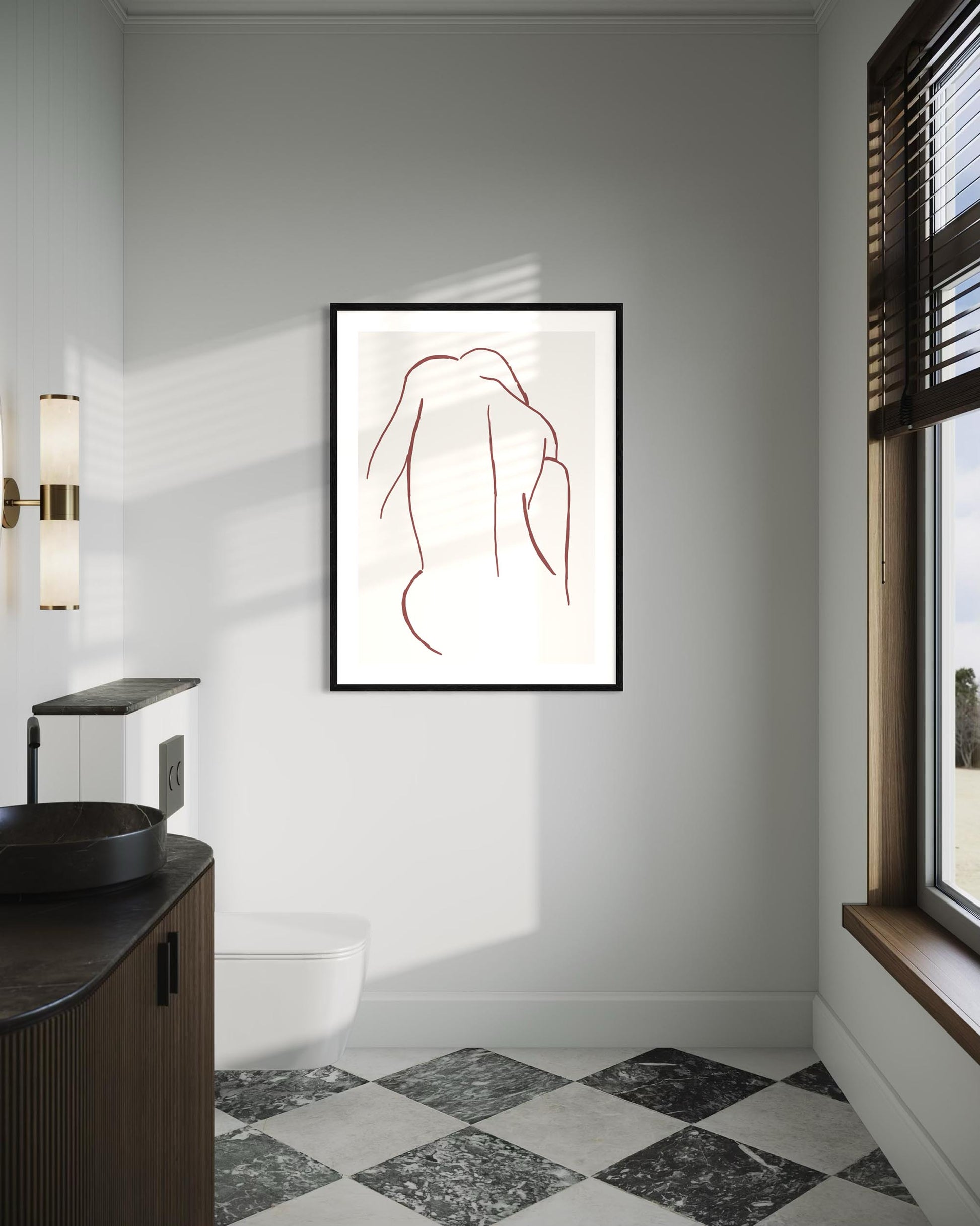 Framed abstract art on a wall in a modern bathroom.