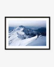Framed photograph of a snow-covered mountain landscape
