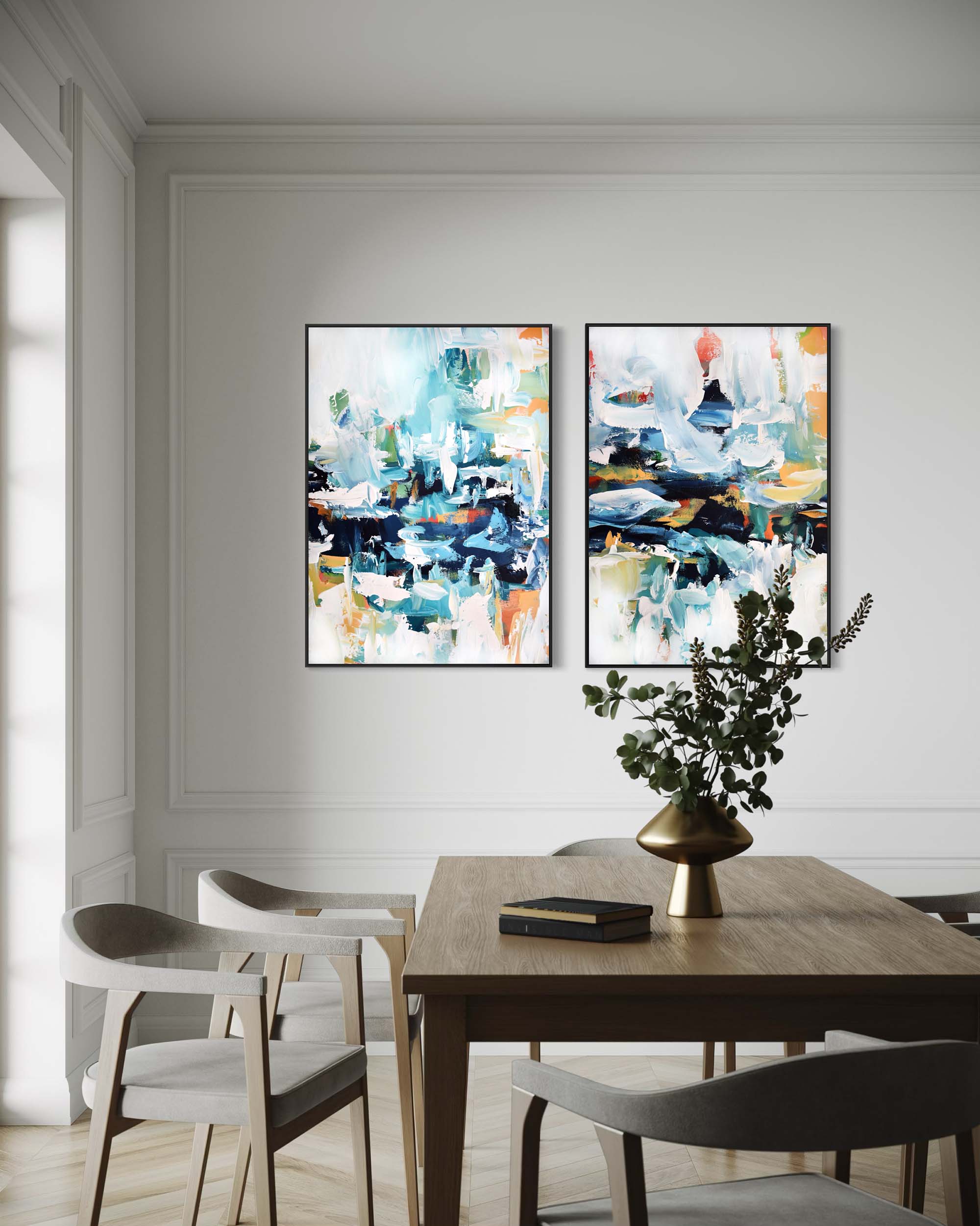 Dining room with abstract art on the wall and a table with decor items.