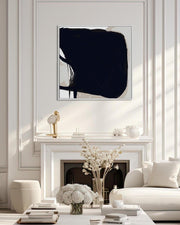 Modern living room with abstract art above a fireplace