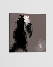Abstract art piece with black and white brush strokes on a gray background