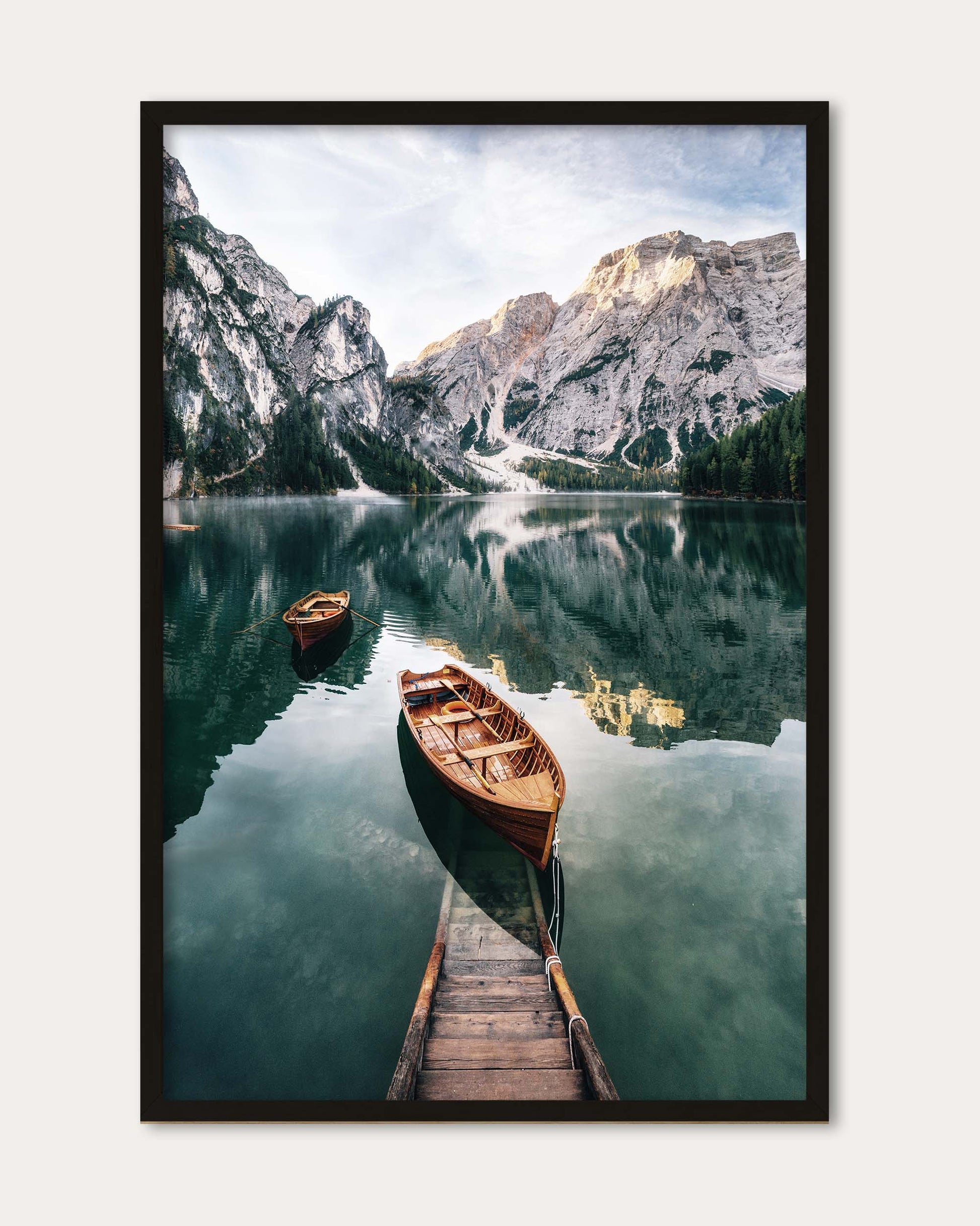 Framed photograph of a mountain lake with a wooden dock and boat.