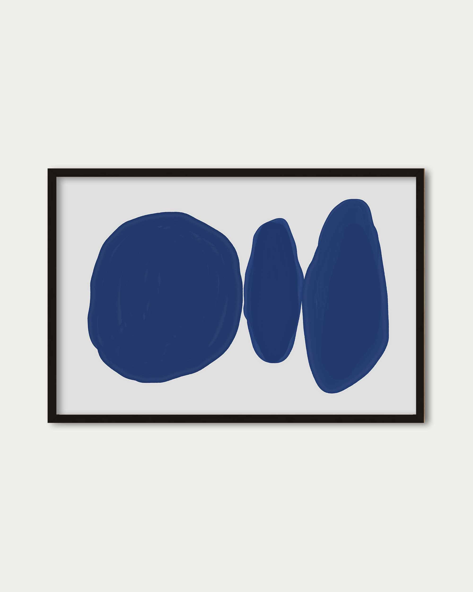 Framed abstract art with blue shapes on a white background