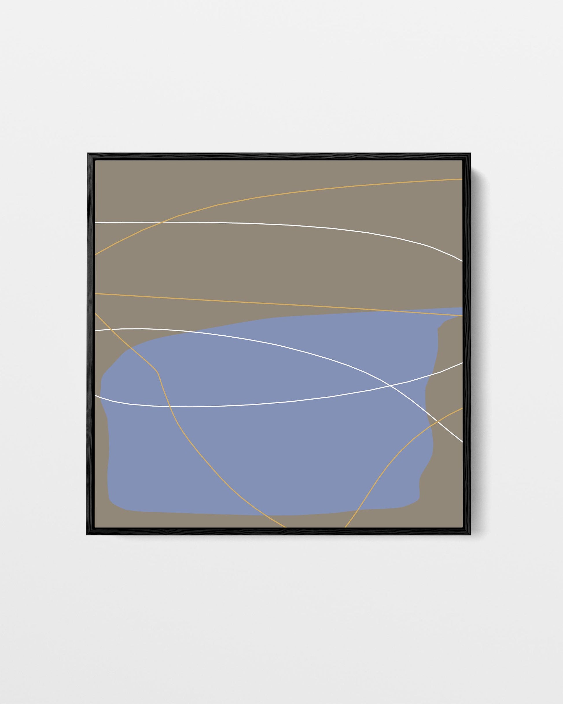 Framed abstract art print with blue shape and gold lines on a beige background