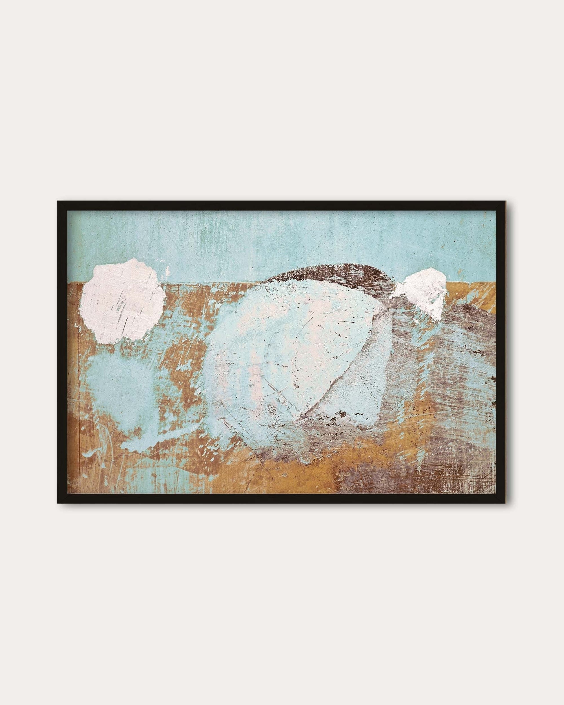 Framed abstract art print with pastel colors on a white wall