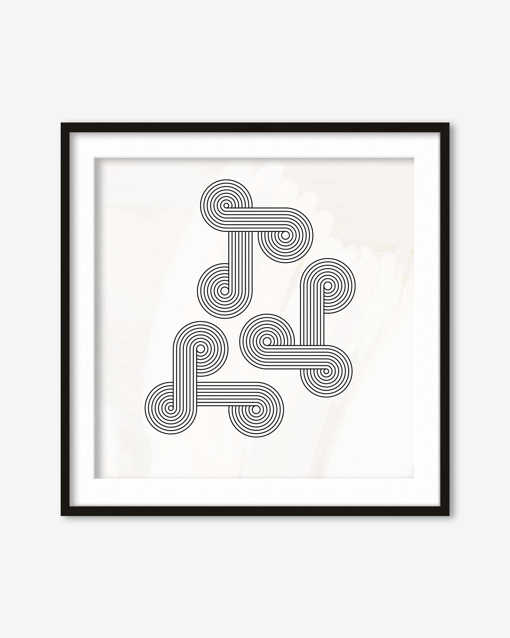 Framed black and white geometric art print on a white background