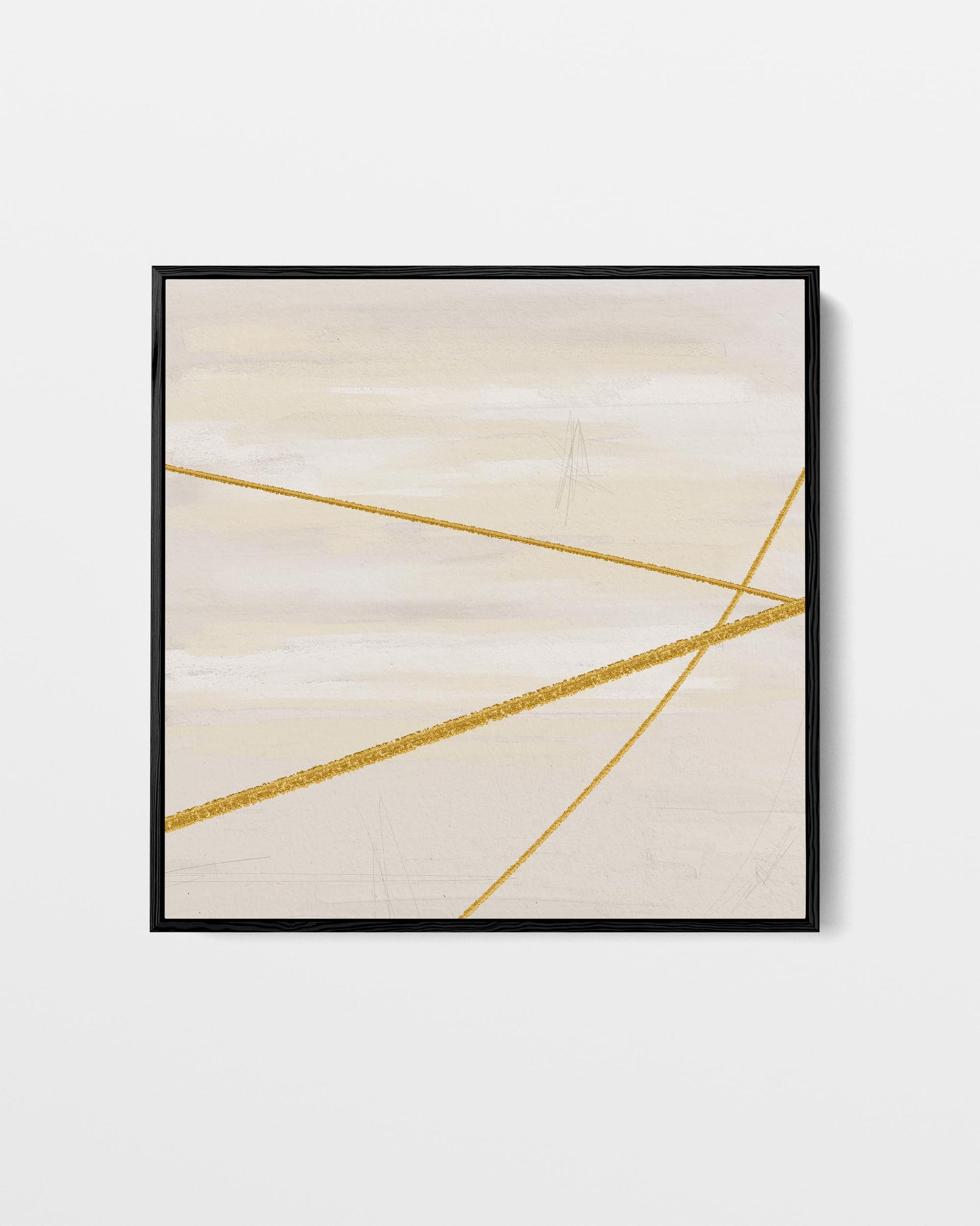 Framed abstract art with gold lines on a beige background