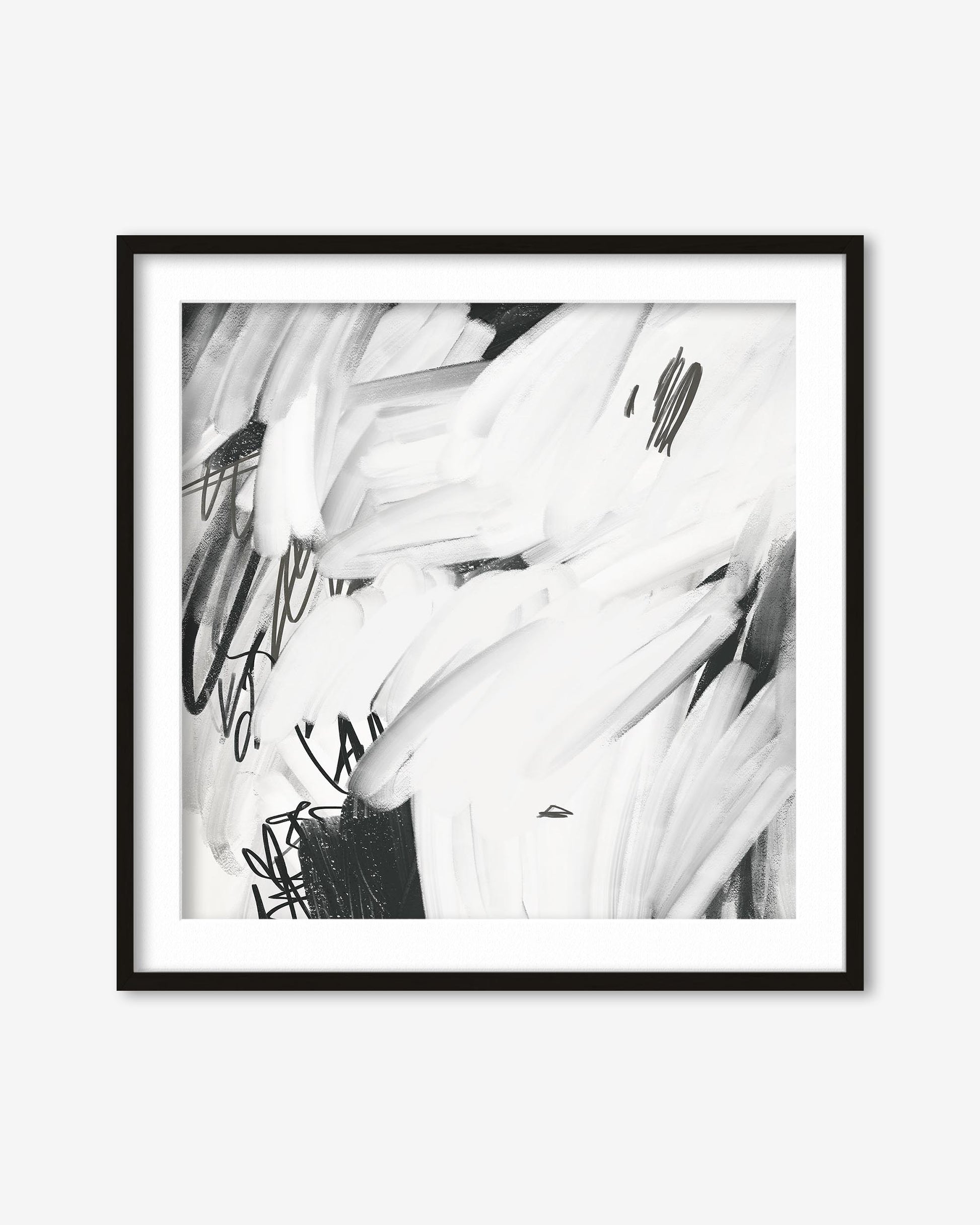 Framed black and white abstract art print on a white wall