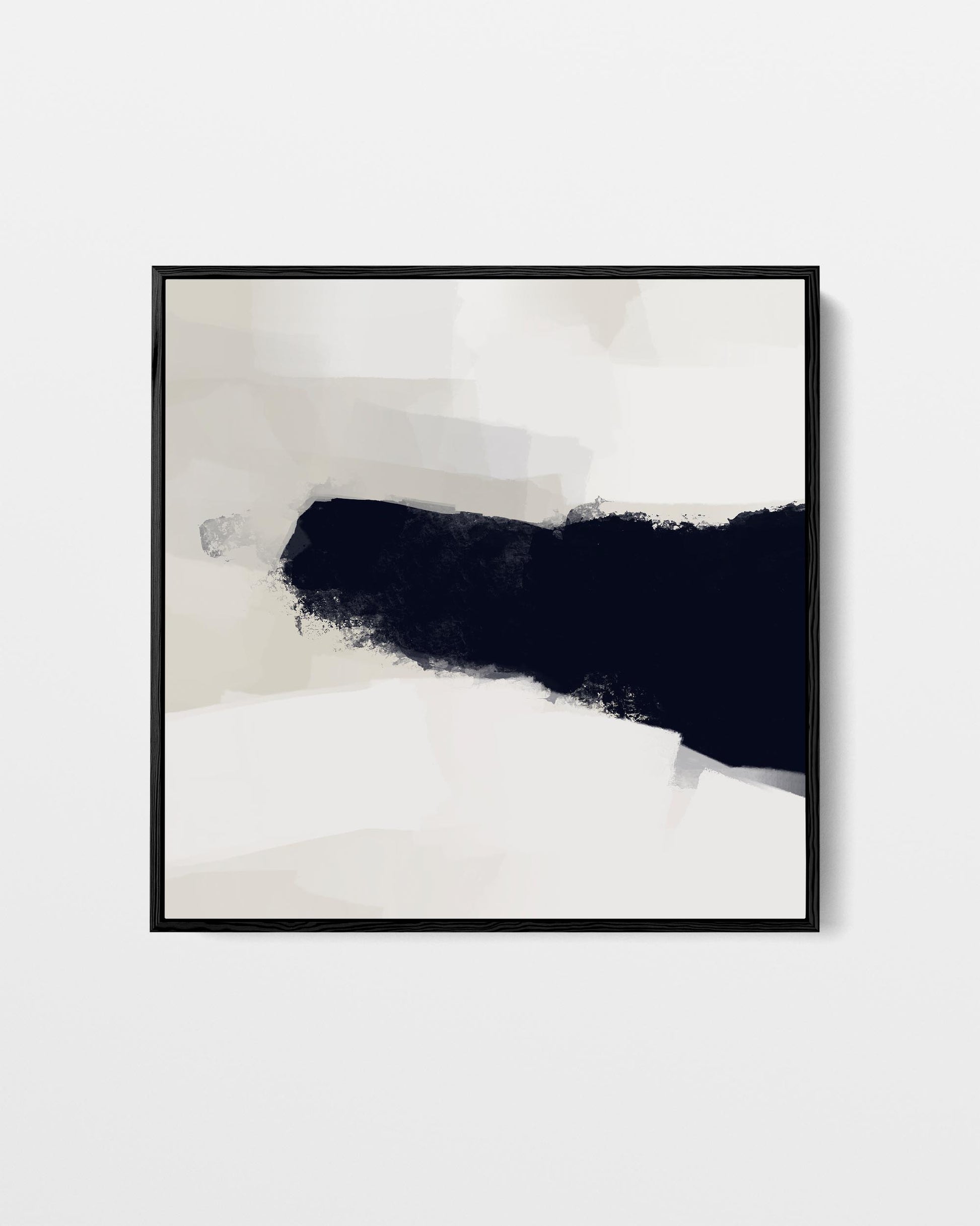 Abstract art print with black and white brush strokes in a black frame on a light gray background