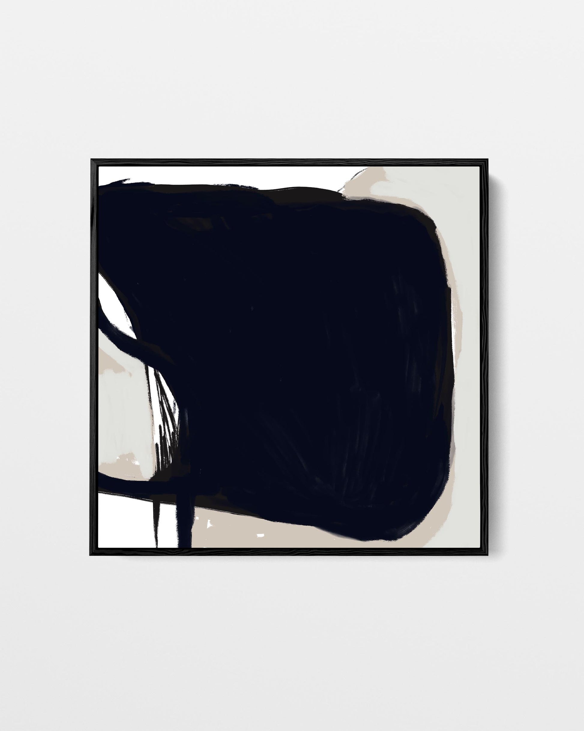 Framed abstract art piece with a large black shape on a light background