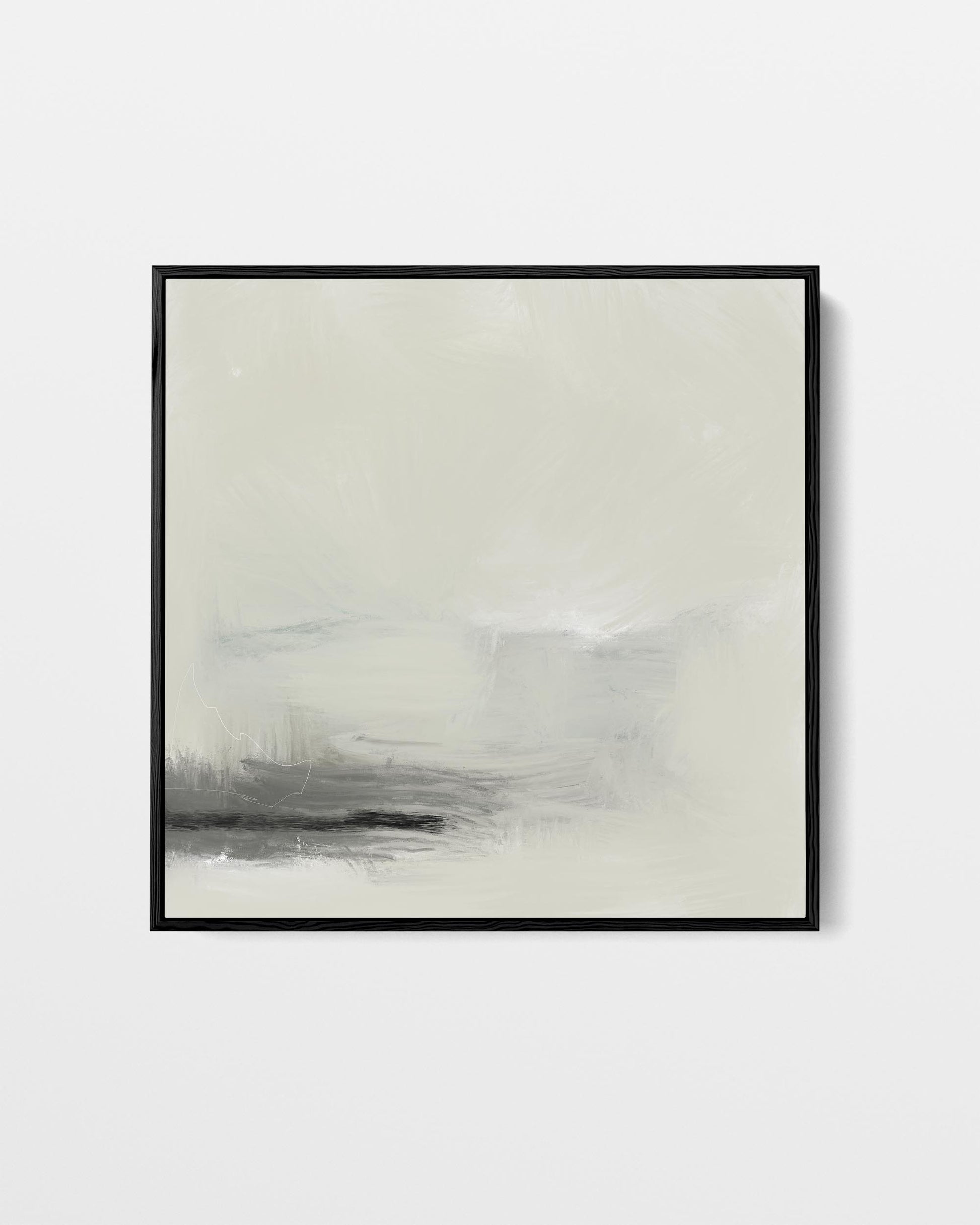 Abstract art print in a black frame on a white wall