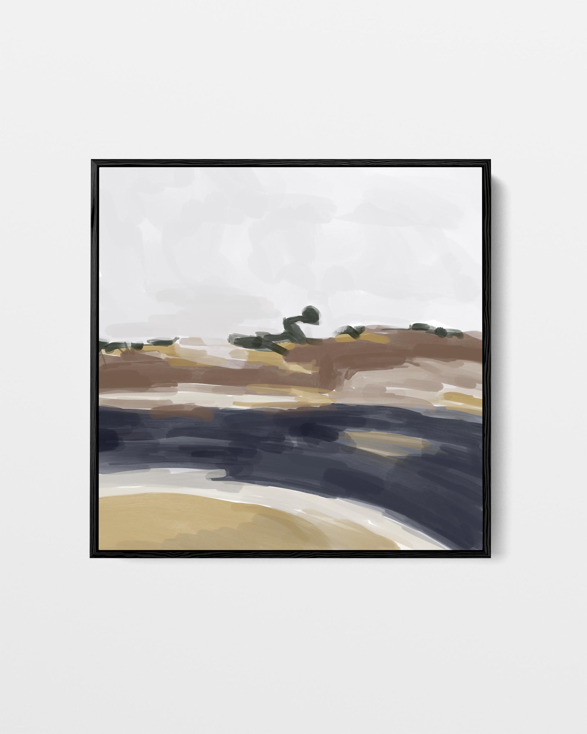 Framed abstract landscape painting on a white wall