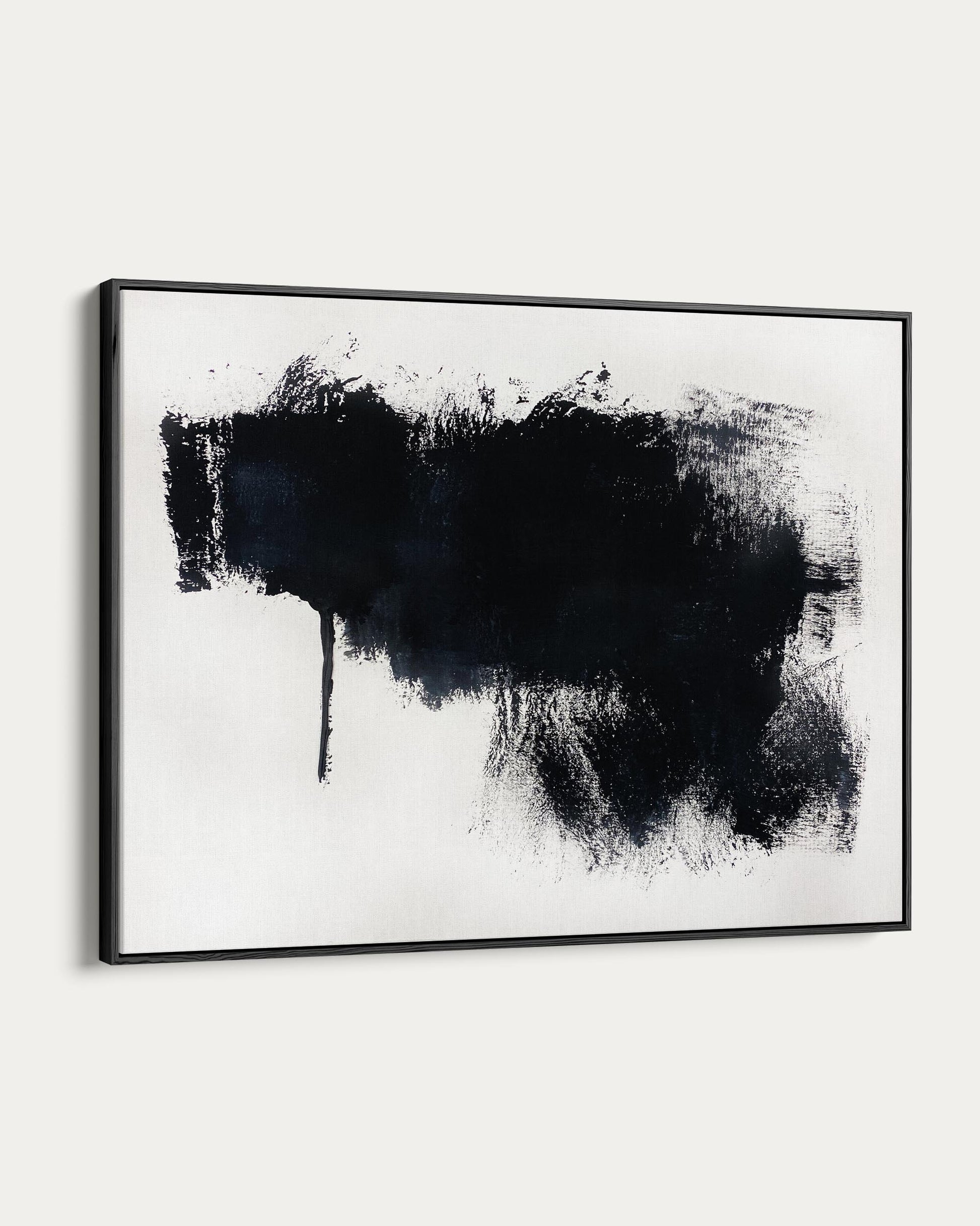 Abstract black paint splatter art print in a black frame on a white background