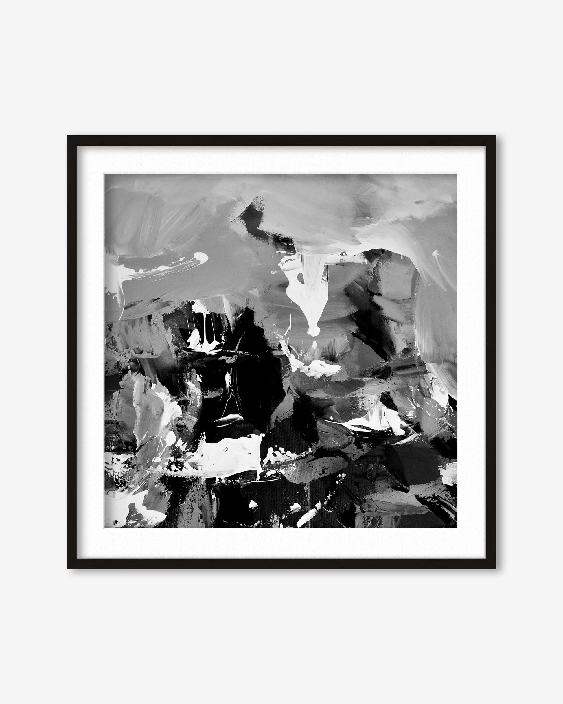 Framed black and white abstract art print on a white wall