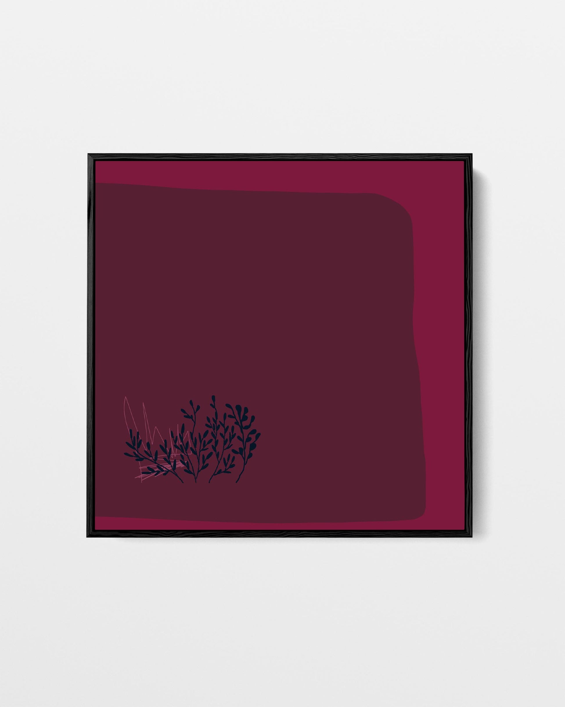 Framed artwork with a dark red background and black floral design on a white background