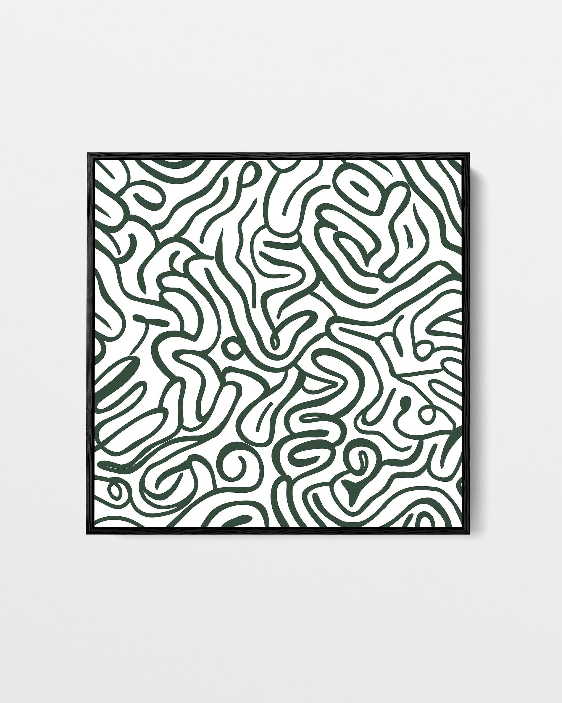 Framed artwork with abstract black and white pattern on a light gray background