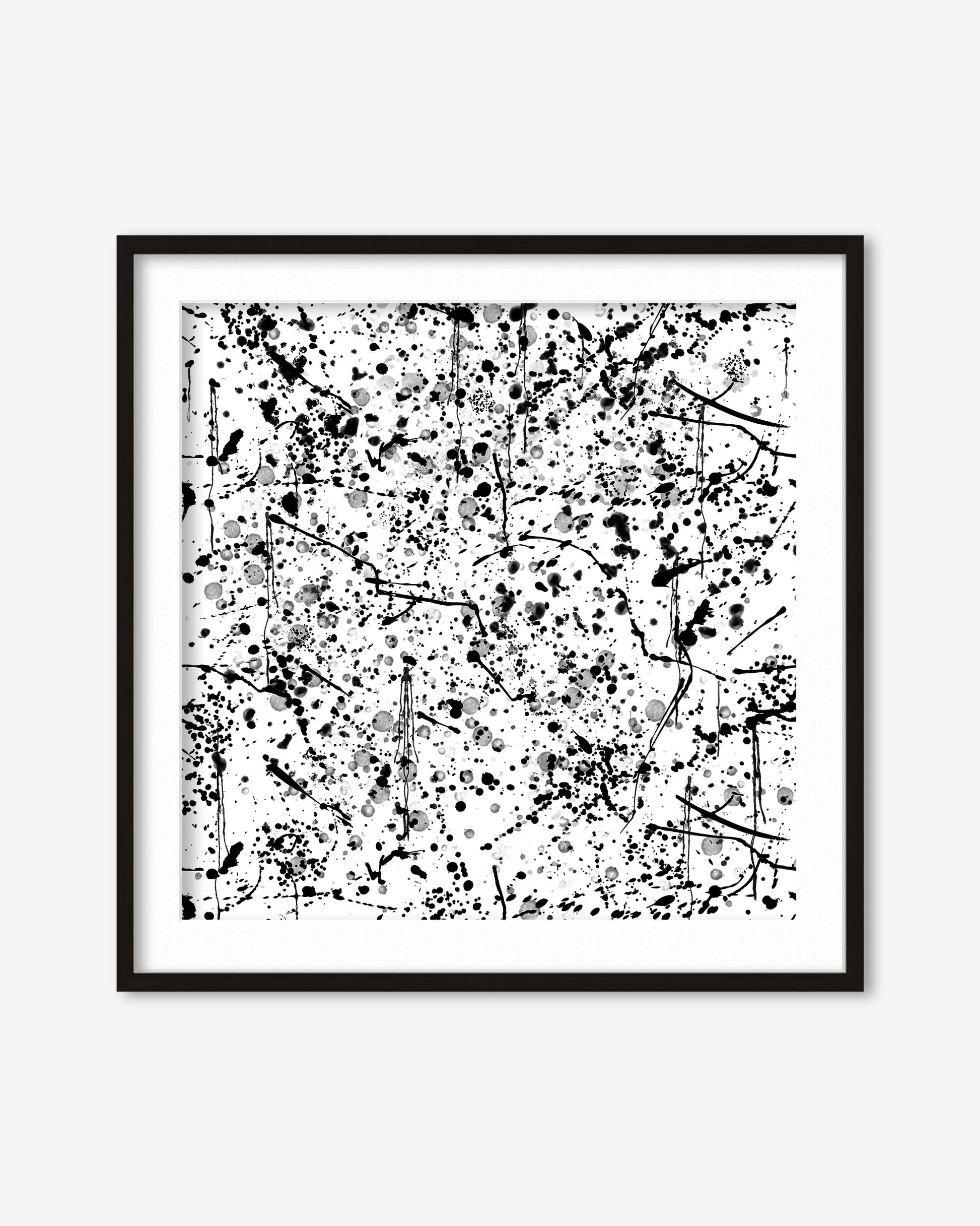 Framed black and white abstract art print on a white wall
