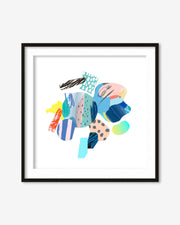 Colorful abstract art print in a black frame on a white wall