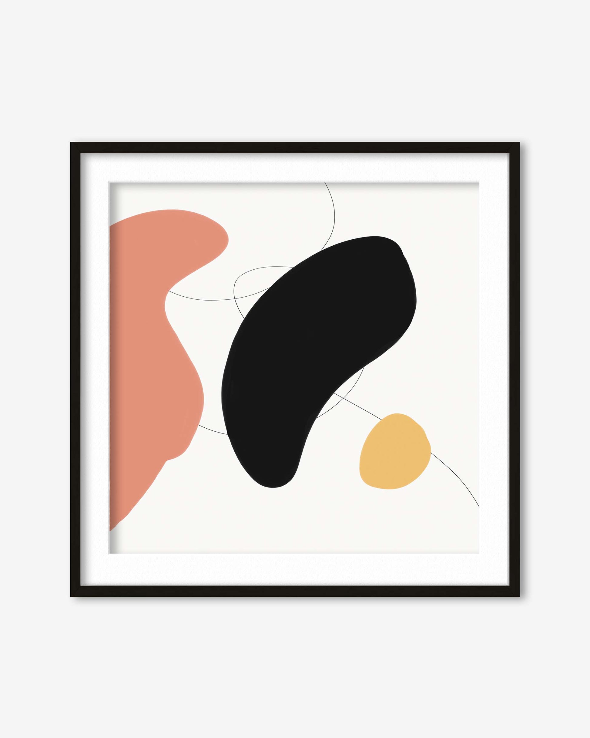 Framed abstract art print with black, pink, and yellow shapes on a white background