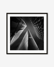 Framed black and white photograph of architectural structures.