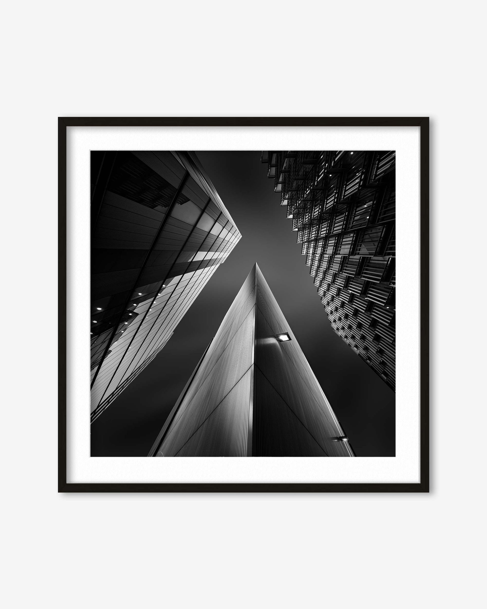 Framed black and white photograph of architectural structures.