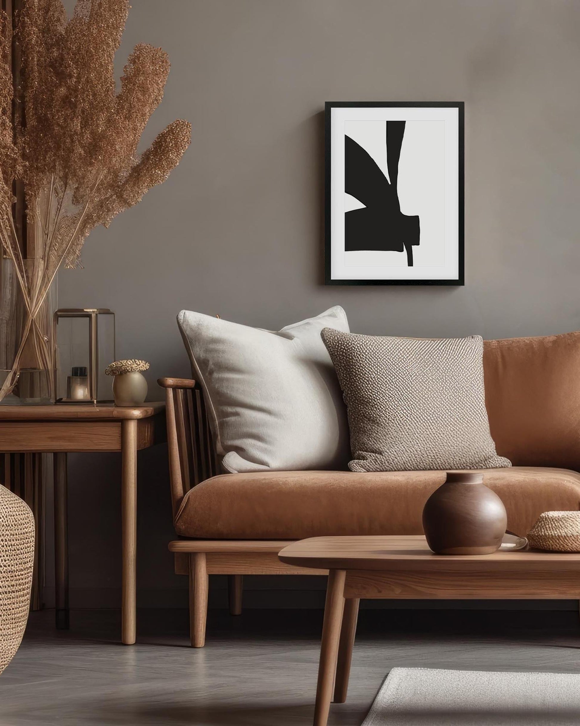 Modern living room with brown sofa, wooden coffee table, and abstract art on wall.