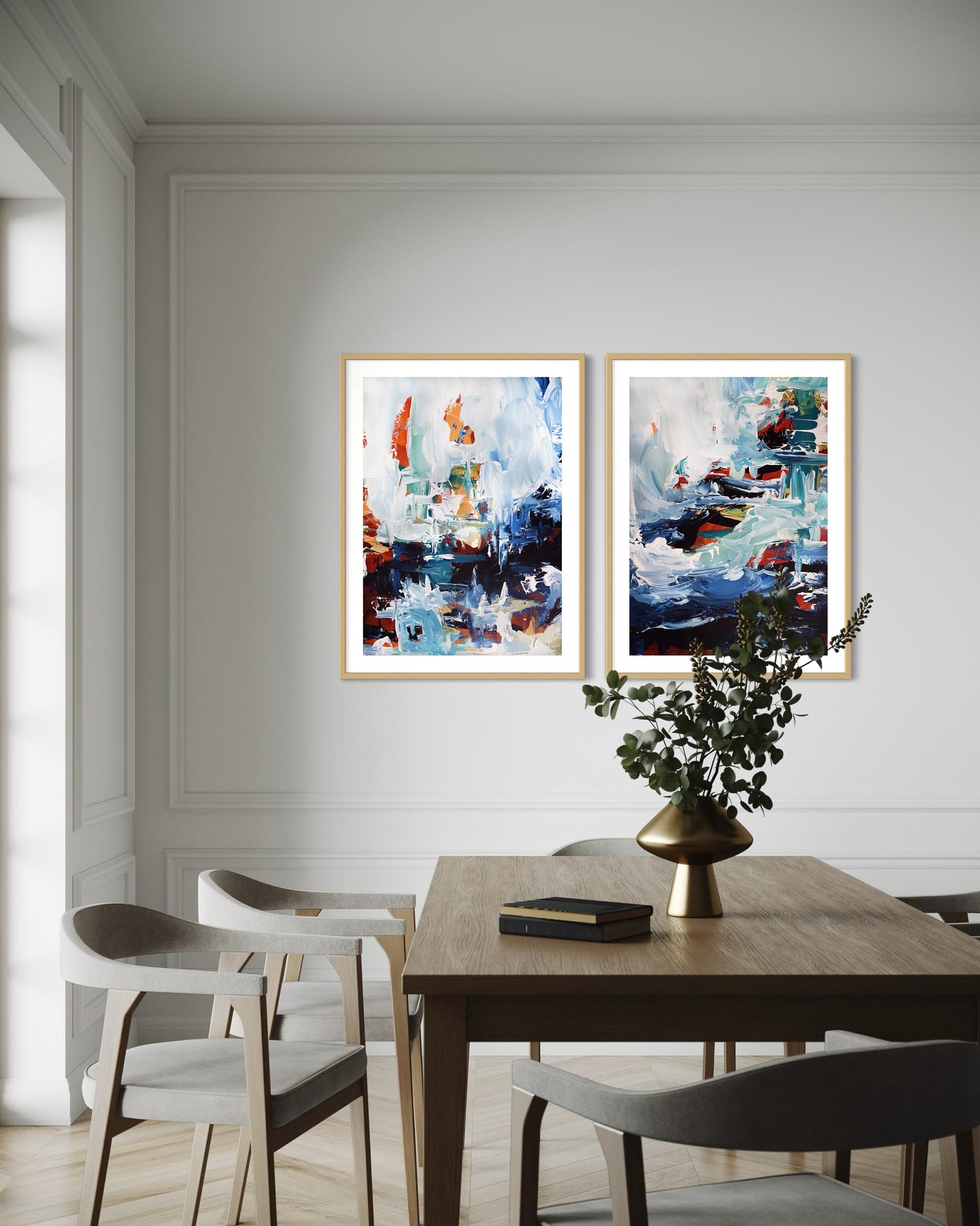 Dining room with abstract art on the wall and a table with decor items.