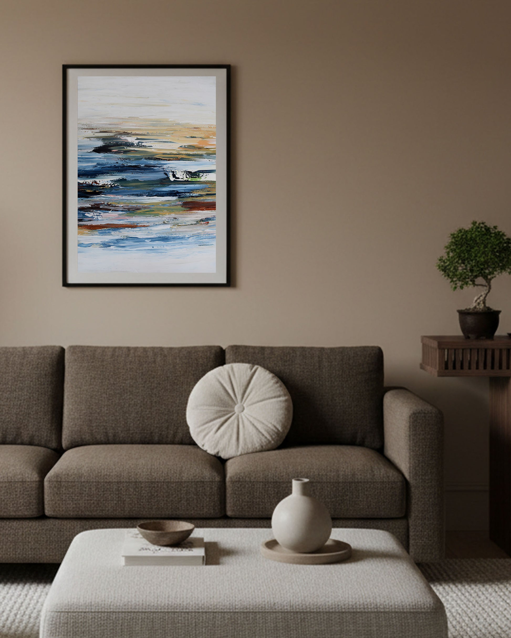 modern neutral living room with brown low 3 seater sofa, large abstract blue and white print on wall