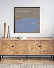 Wooden sideboard with abstract art on the wall