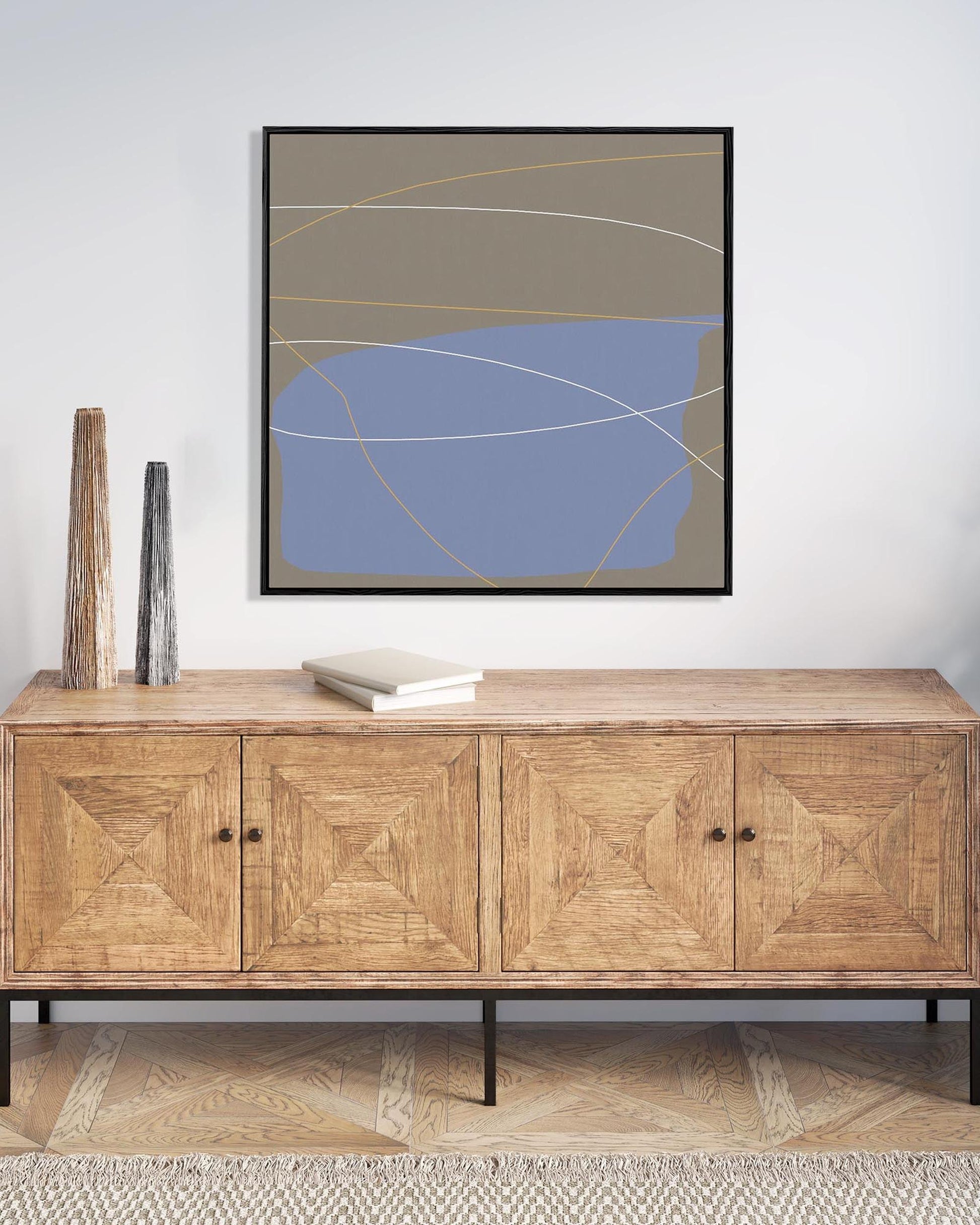 Wooden sideboard with abstract art on the wall
