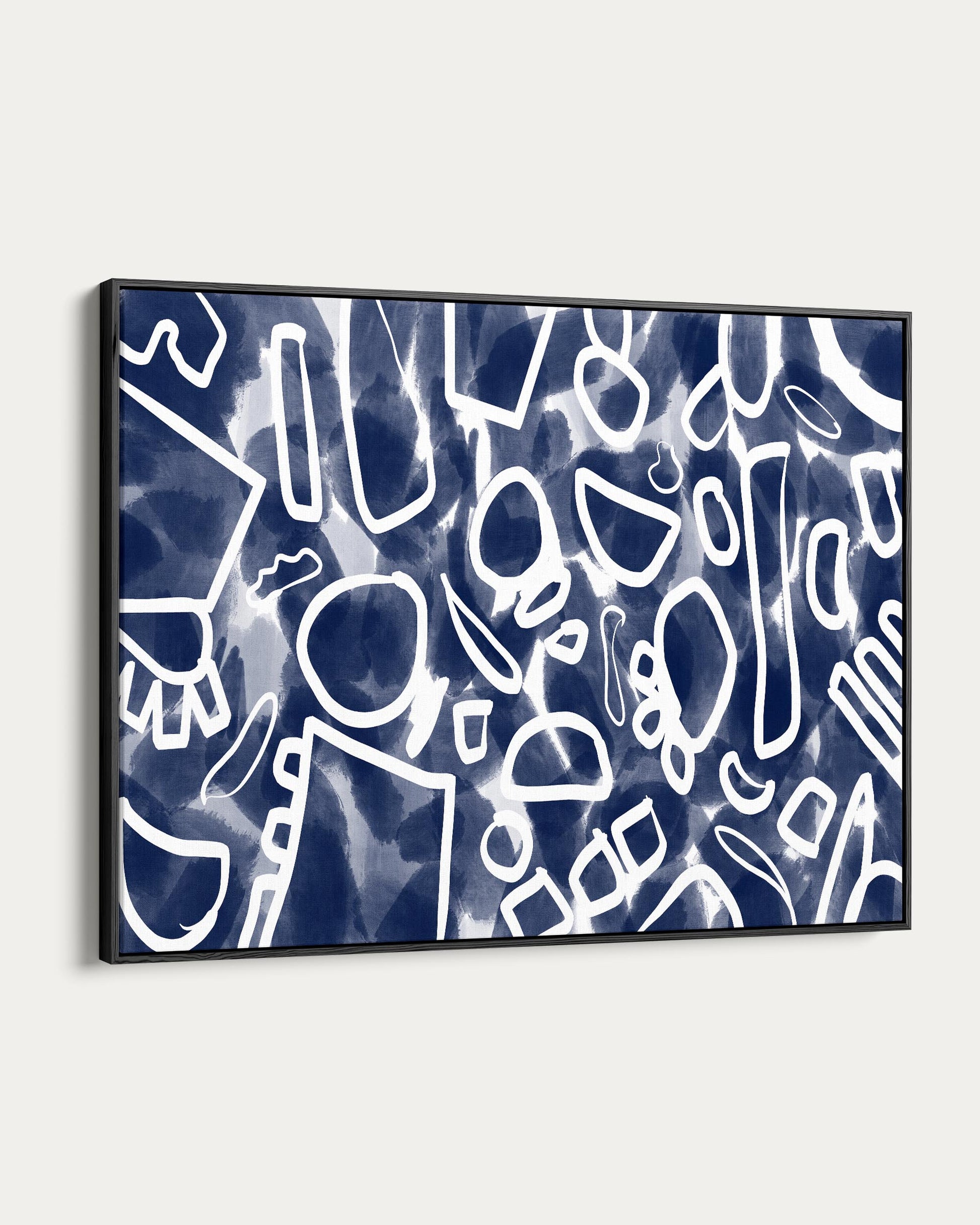 Framed abstract art with blue and white pattern on a white background