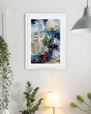 Framed abstract painting on a wall with plants and a lamp in the background