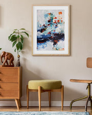 Nest of wooden furniture including a dresser, stool, and chair with a colorful abstract painting on the wall.