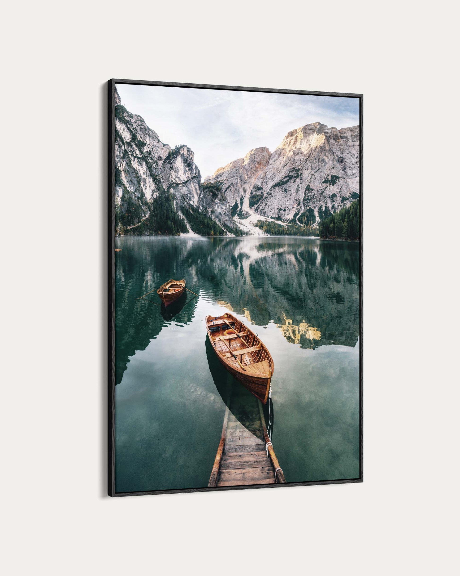Framed photograph of a mountain lake with boats and a dock.