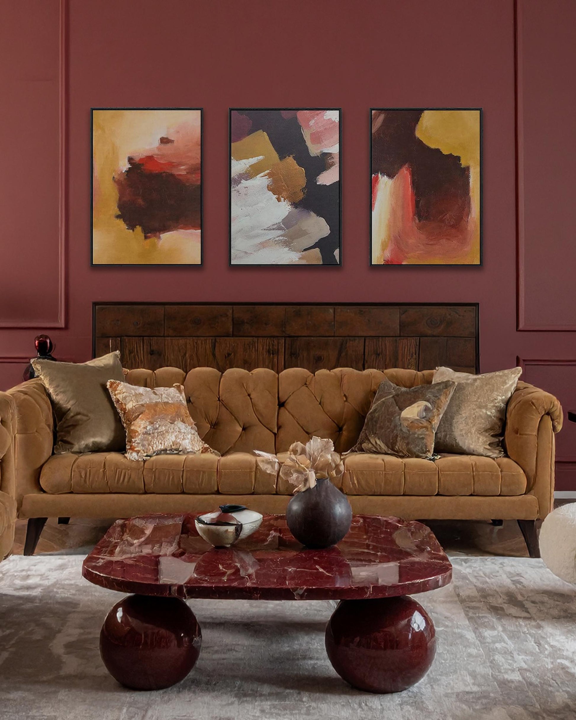 modern bold burgundy living room with re marble table ball legs with modern abstract expressive canvas art on wall