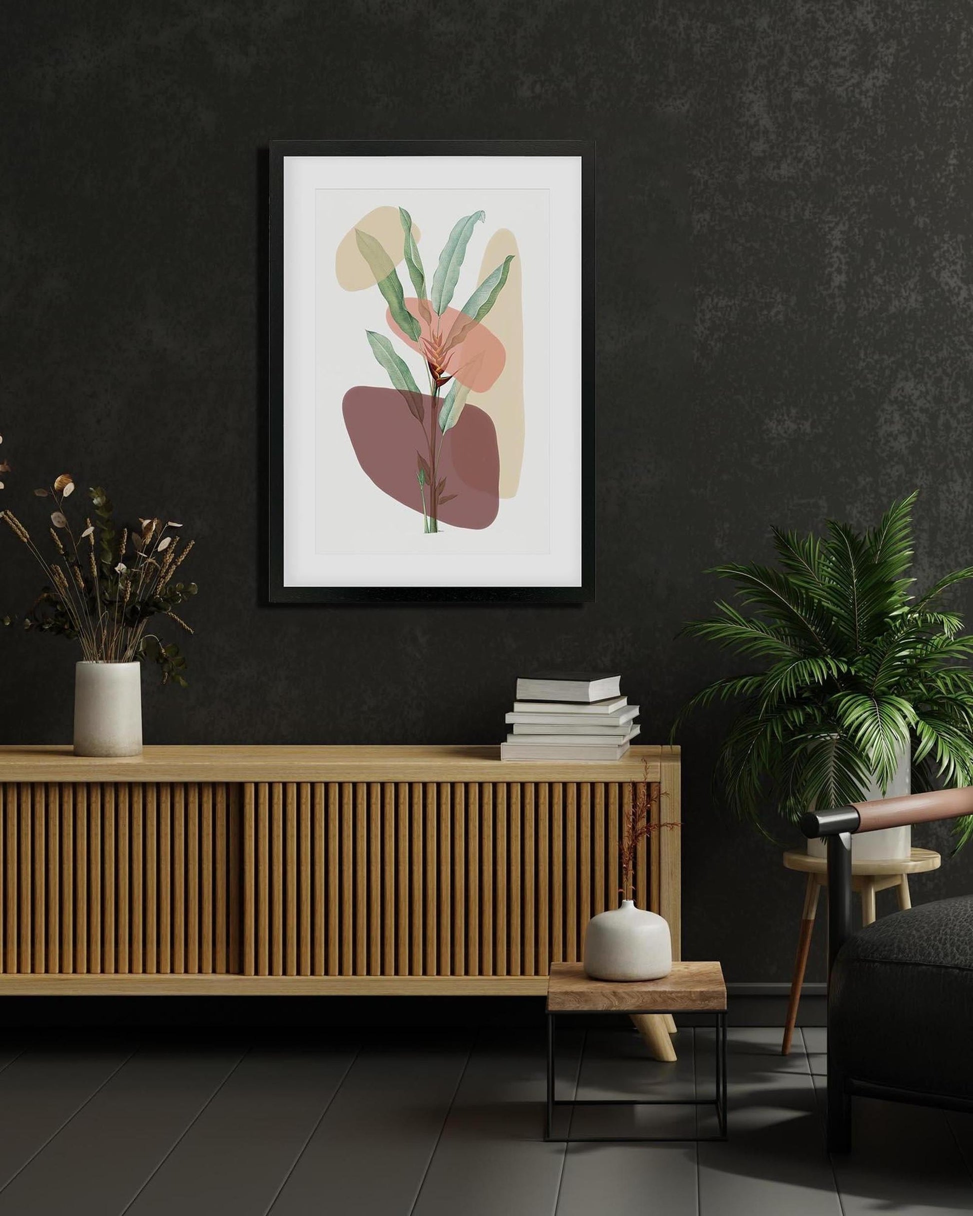 Framed abstract art print on a dark wall above a wooden cabinet with decorative items.