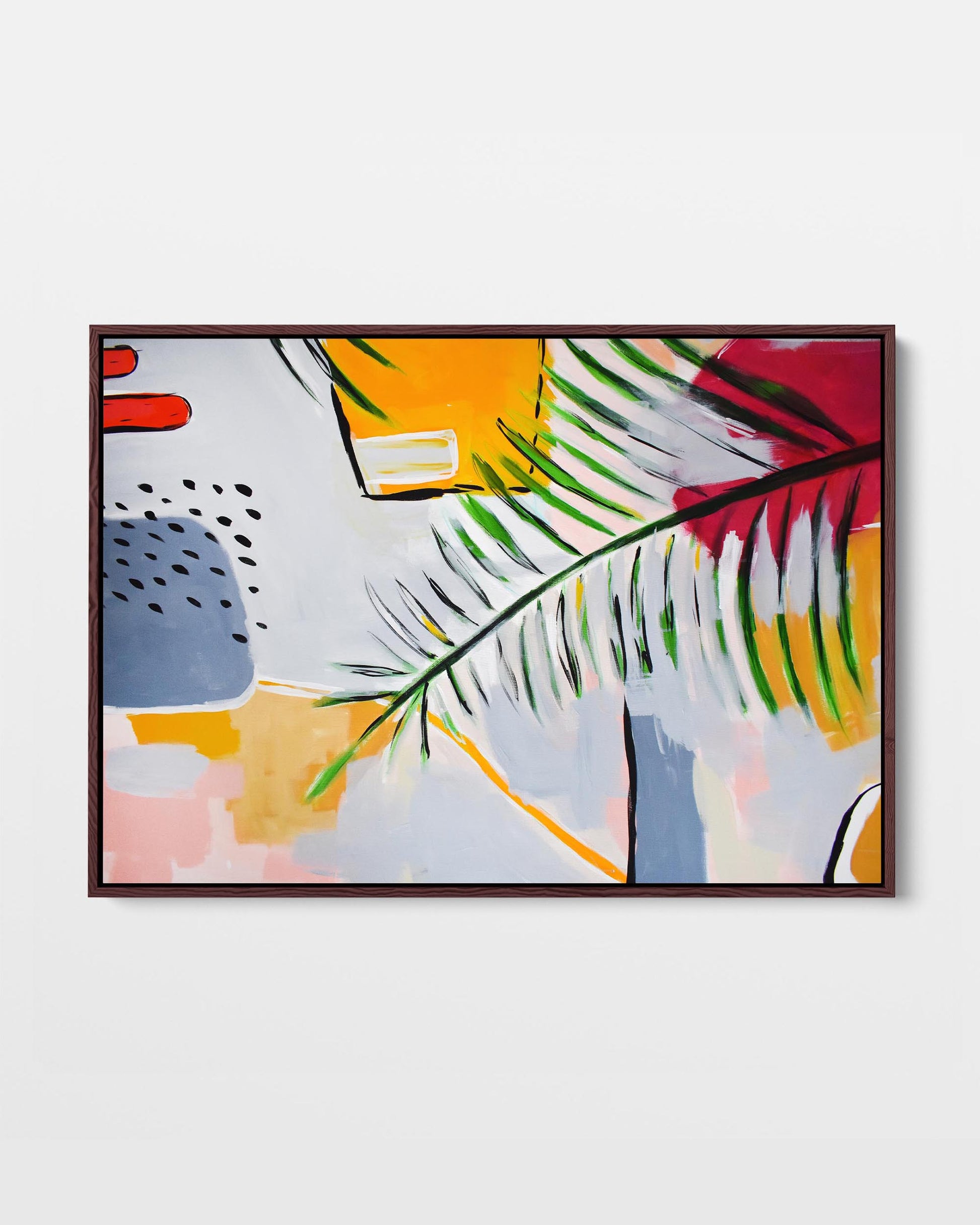 A vibrant abstract leaf design on a framed canvas, with modern yellow, red, green, and blue tones.