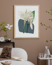 Framed artwork of a floral design on a wall in a living room setting.