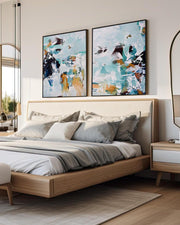 Modern bedroom with a bed, abstract art on the wall, and a side table.