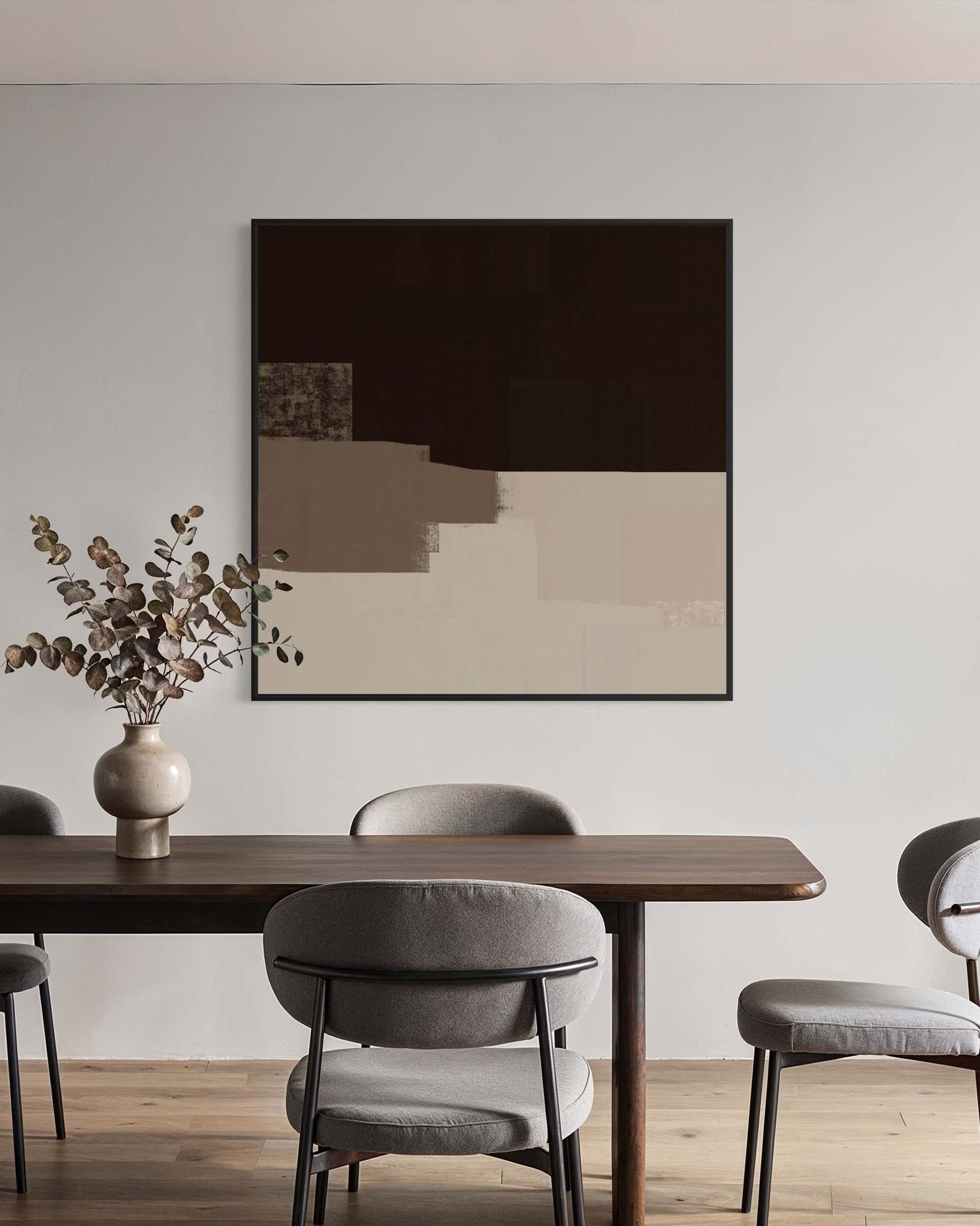 Dining room with a wooden table and gray chairs, abstract art on the wall.