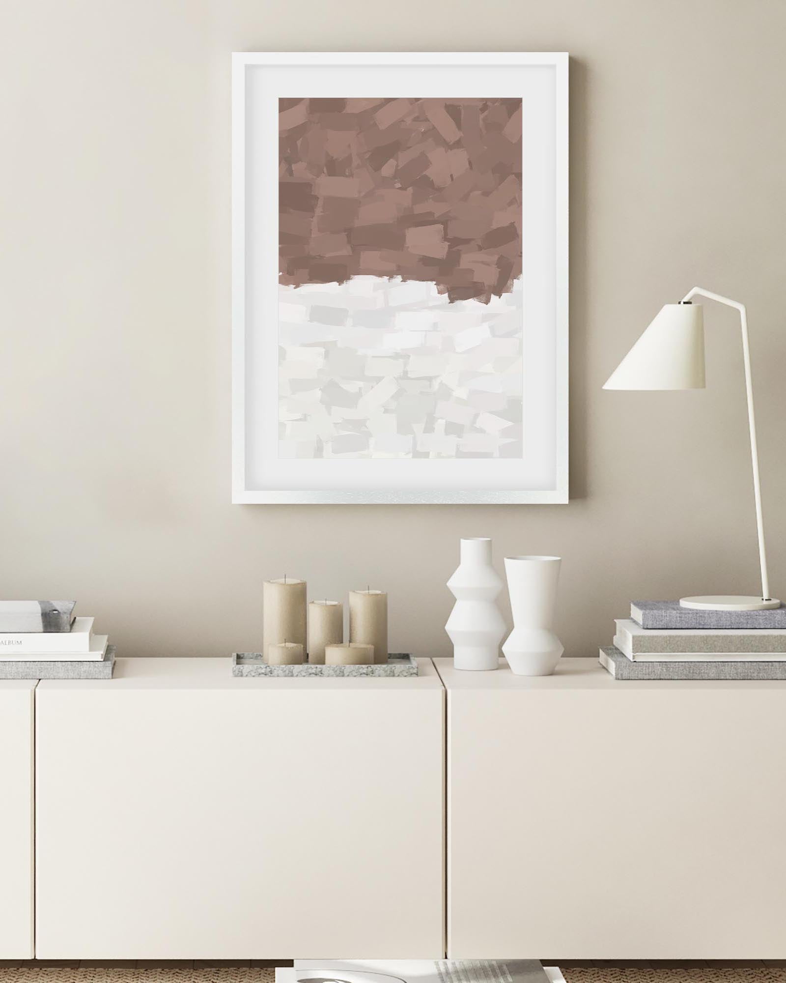Modern interior with a framed abstract artwork on a wall above a white console table.