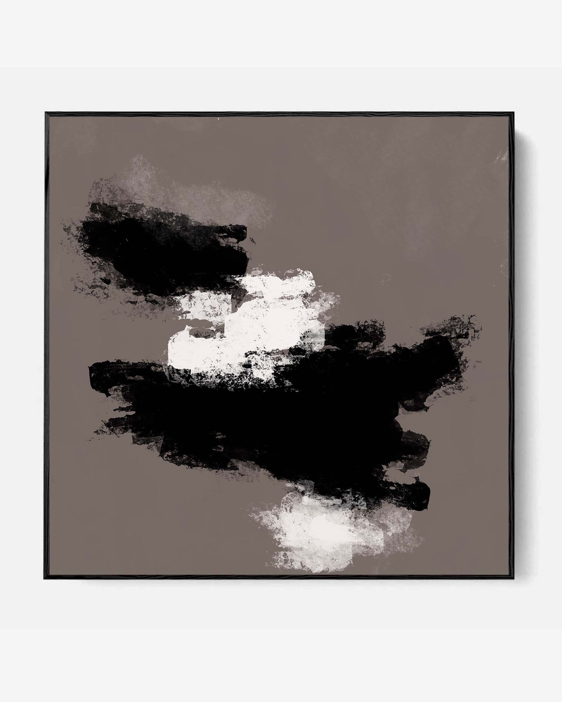 A framed canvas featuring an abstract design with black, grey, and white colors, presented in a simple black frame.