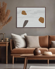 Modern living room with a brown sofa, wooden coffee table, and abstract art on the wall.