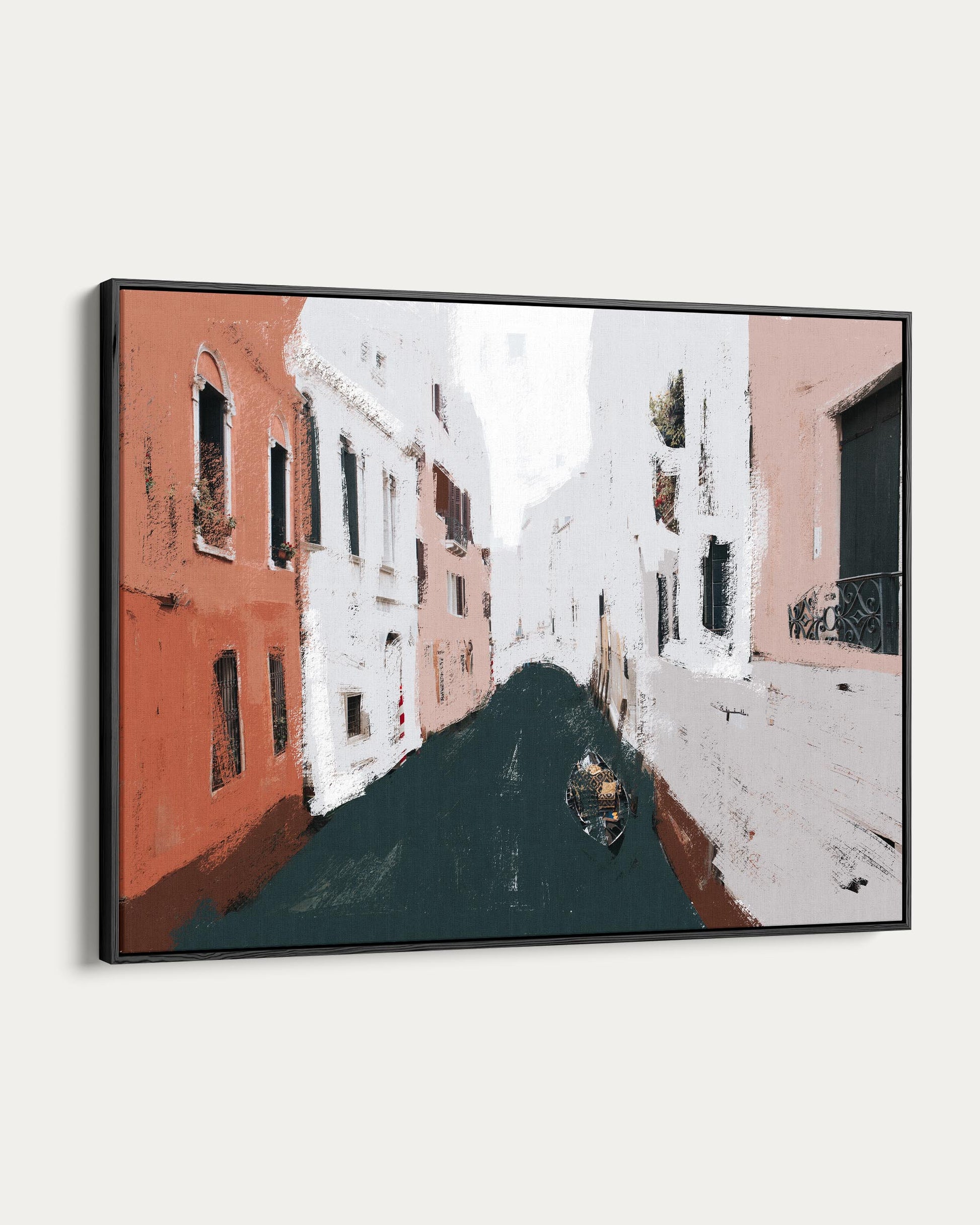 Framed artwork of a street scene with buildings and a boat.