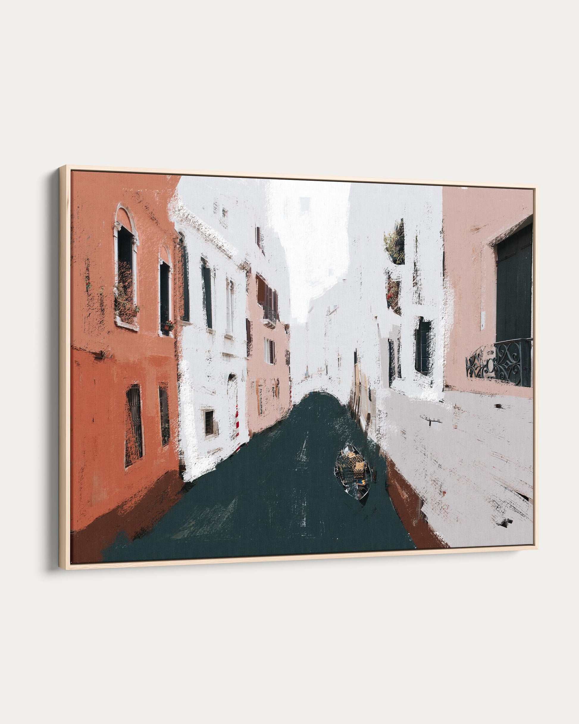 Framed artwork of a street scene with buildings and a boat.