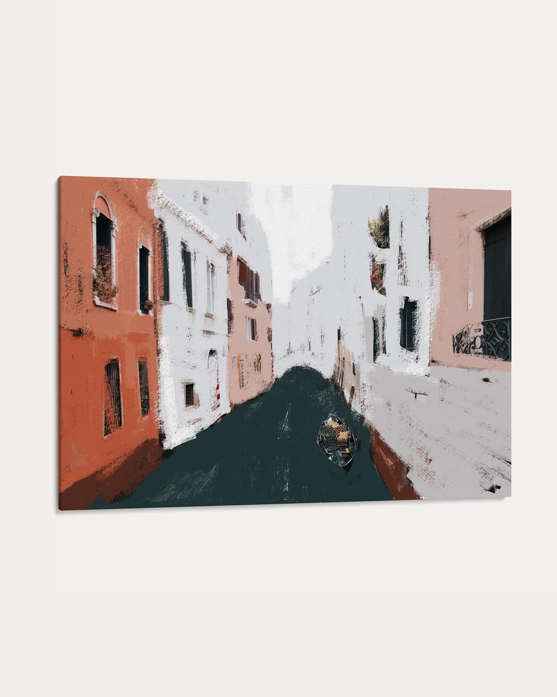 Venetian canal with gondola between snow-covered buildings