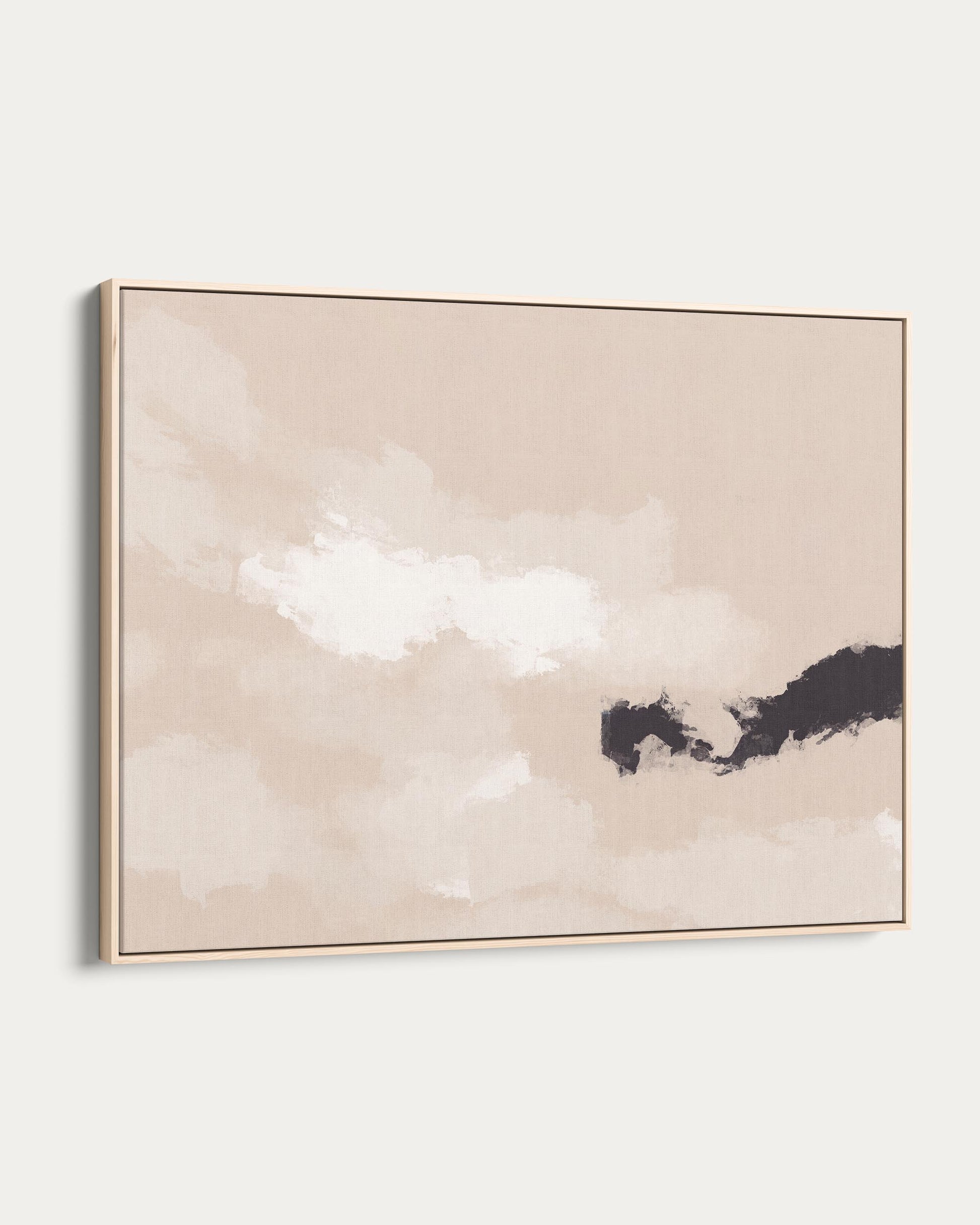 Abstract art piece with a gold frame on a white wall