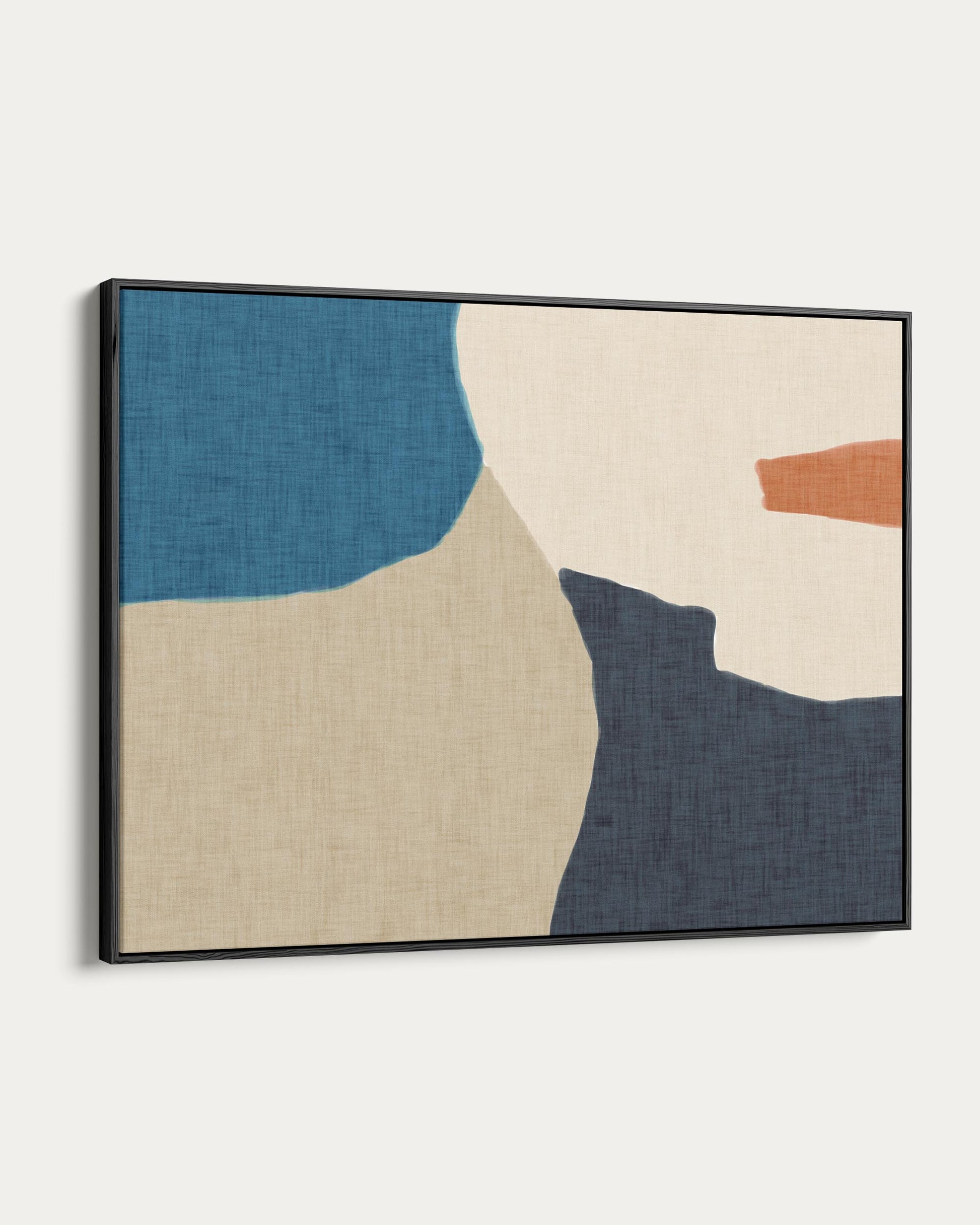 Abstract art print with geometric shapes in blue, beige, and orange on a white wall.