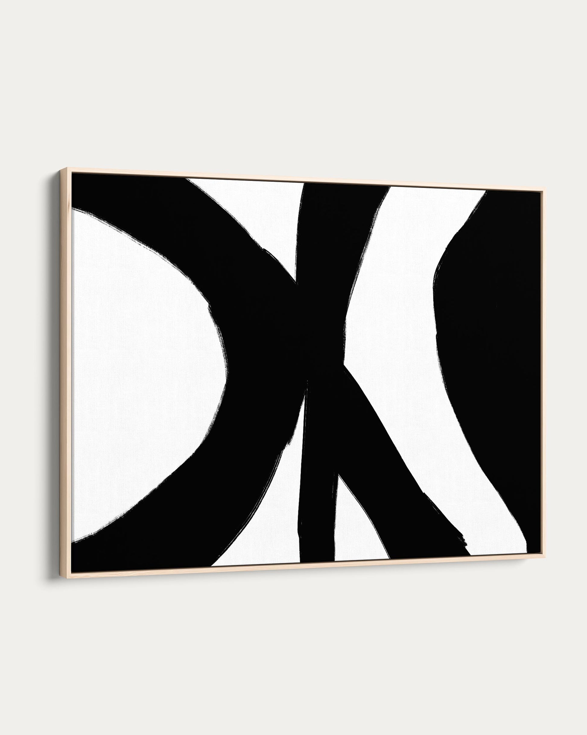 Abstract black and white artwork on a white wall