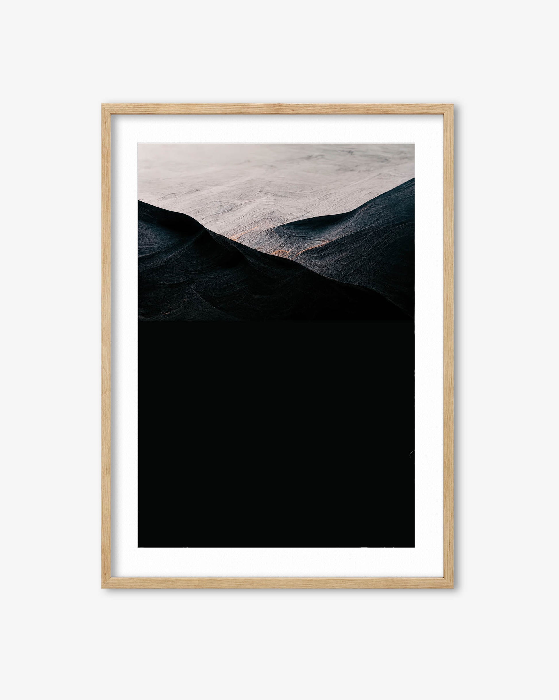 Framed artwork of a mountain landscape with a wooden frame on a white background